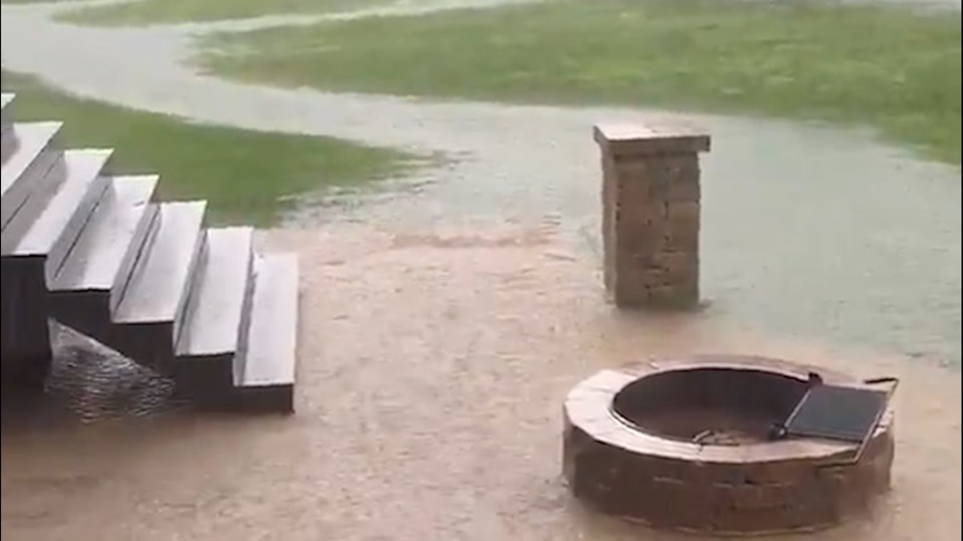 A powerful thunderstorm left parts of Louisville, Kentucky, flooded on Aug. 13, including the backyard of one home.