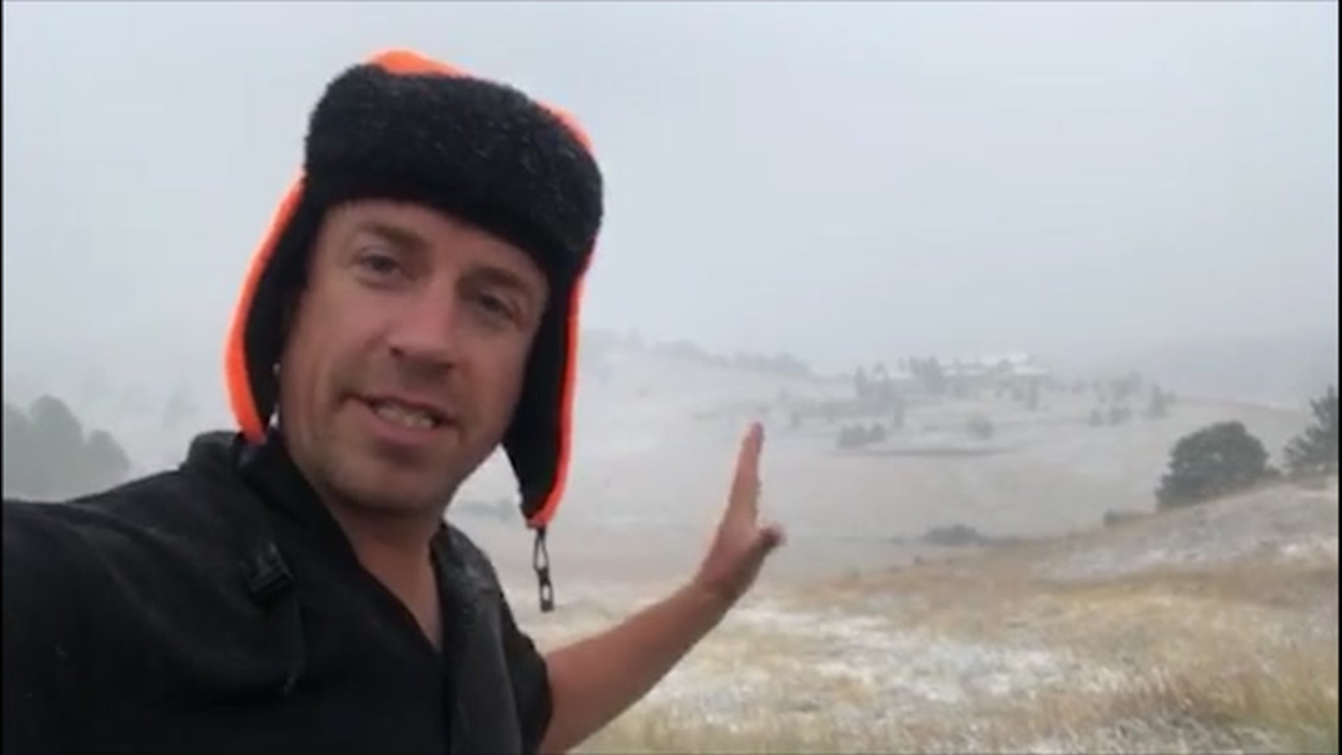 Snow begins to accumulate as extreme meteorologist Reed Timmer reports in Genesee, Colorado on September 8, 2020.