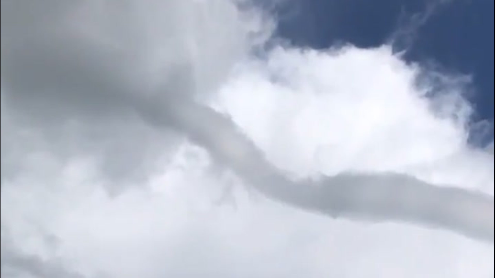 Some fairly astonished onlookers saw a landspout swirling overhead in Laton, California, on April 6.