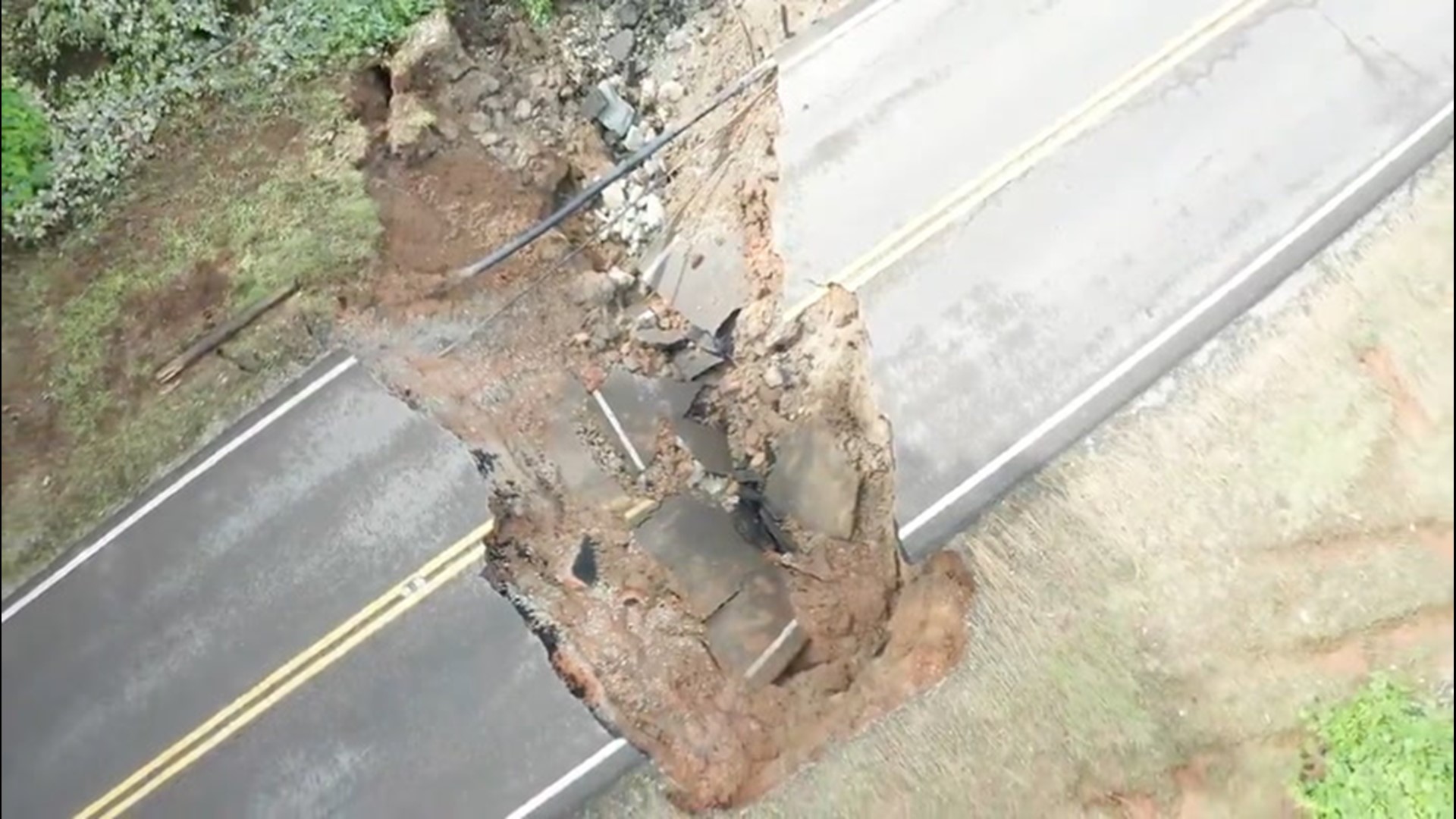 Serious flooding in Jackson, Tennessee, caused Christmasville Road to sink into the earth on July 1. The road is closed between Oakfield and Watson roads.