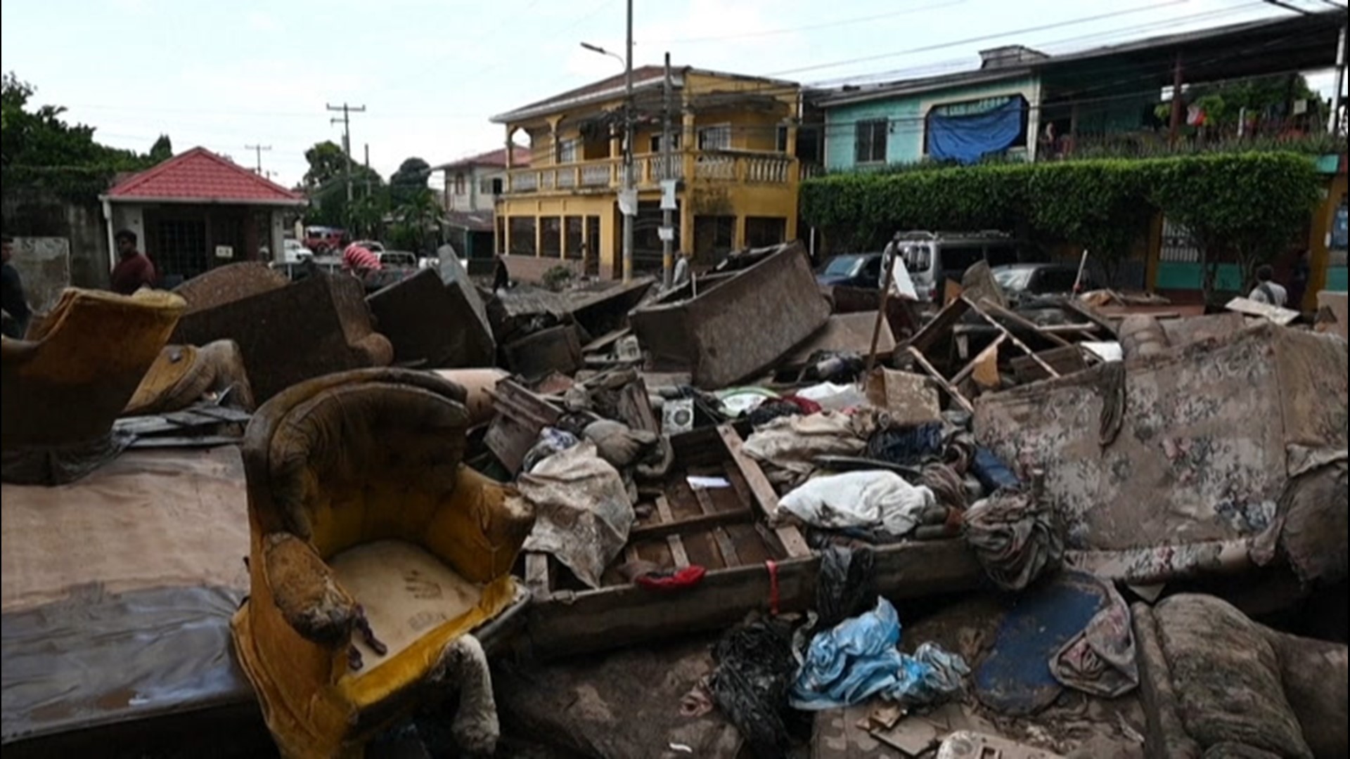 Residents in Villanueva, Honduras, cleared mud and debris from homes and streets on Nov. 7, after Eta brought torrential downpours to the country, causing flash flooding.