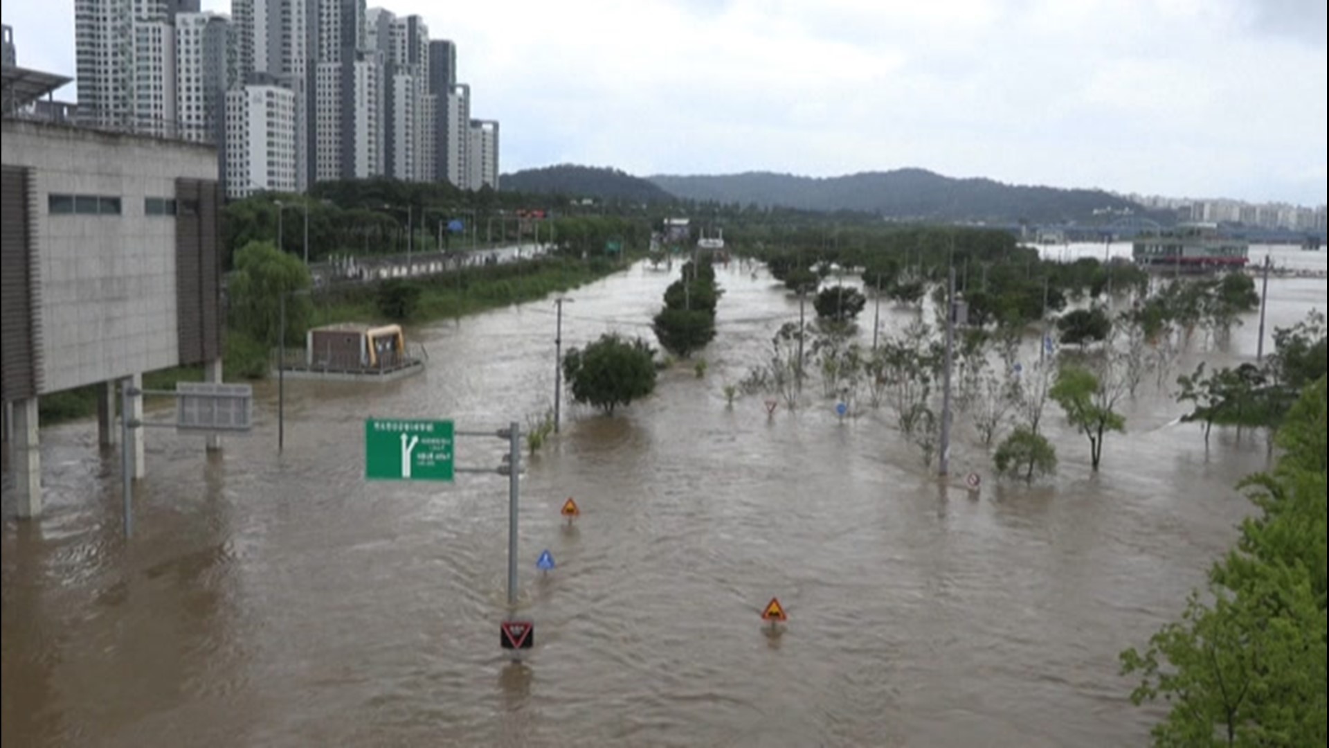Roads in Seoul, South Korea, were closed on Aug. 3, as heavy rain caused the Han River to overflow its banks.