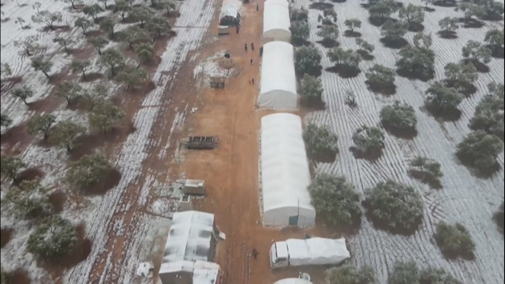 Syrians displaced by war are facing new challenges, with freezing weather and snow blanketing the camp that humanitarian officials say was already inadequate.