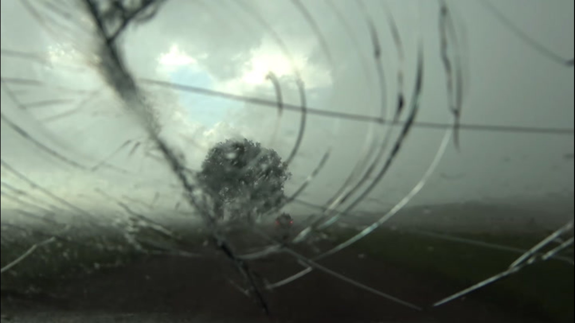 Large hail destroyed this windshield near the Wyoming and Montana border on July 6. A tornado shortly appeared in the same storm near the town of New Haven.