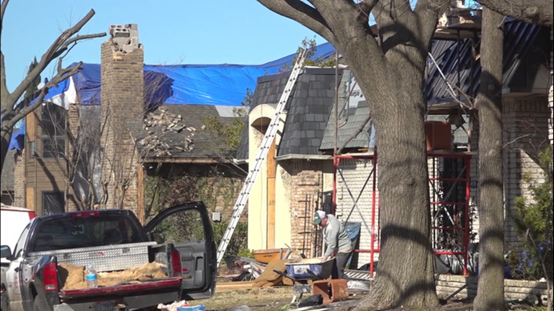 Contractors are busy repairing homes and demolishing parts of a damaged shopping plaza on Feb. 24, roughly four months after an EF-3 tornado tore through the Preston Hollow neighborhood in Dallas, Texas.