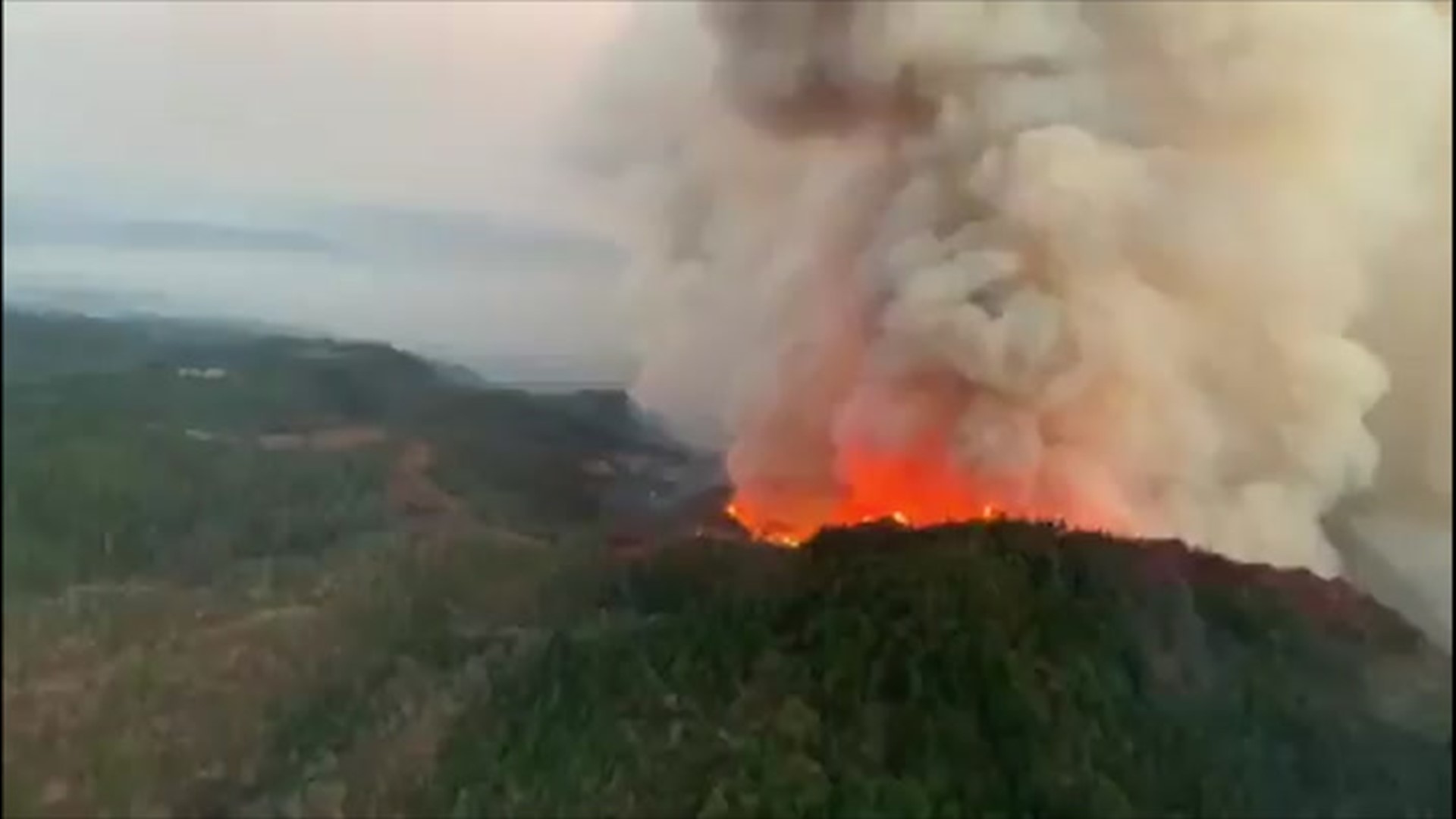 Aerial footage captured near Angwin, California, shows the Glass Fire raging on a mountaintop on Sept. 28. The fire started on Sept. 27 and has quickly grown to a size of more than 36,000 acres.