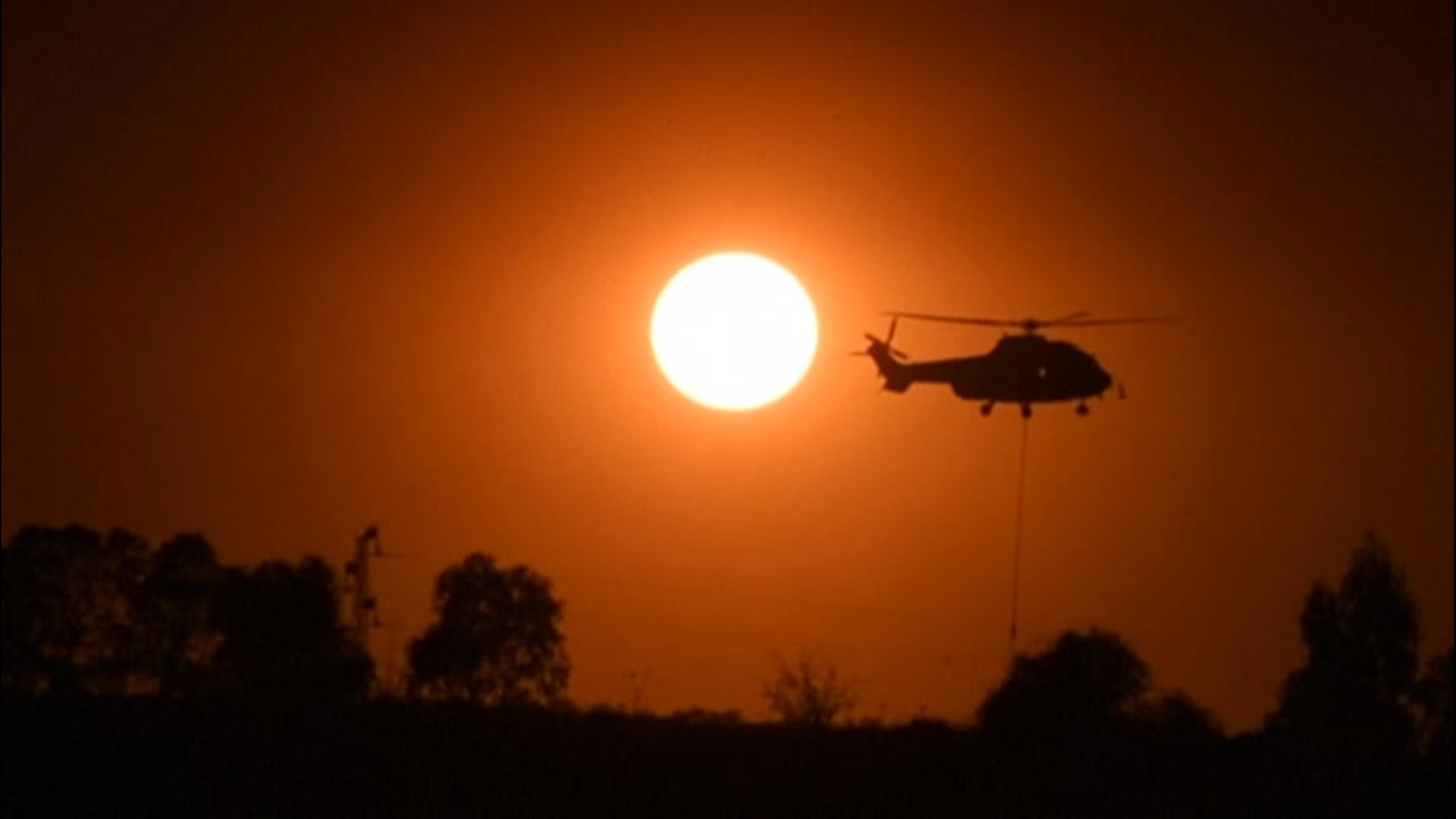 Wildfires burning in Huelva, Spain, prompted more than 3,200 people to evacuate on Aug. 30. The smoke rising from the fires caused the sky to turn orange.