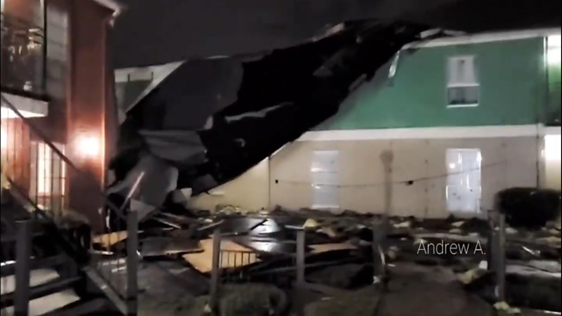 A tornado-warned storm ripped the roof off a building, as it swept through Arlington, Texas, on Nov. 24.