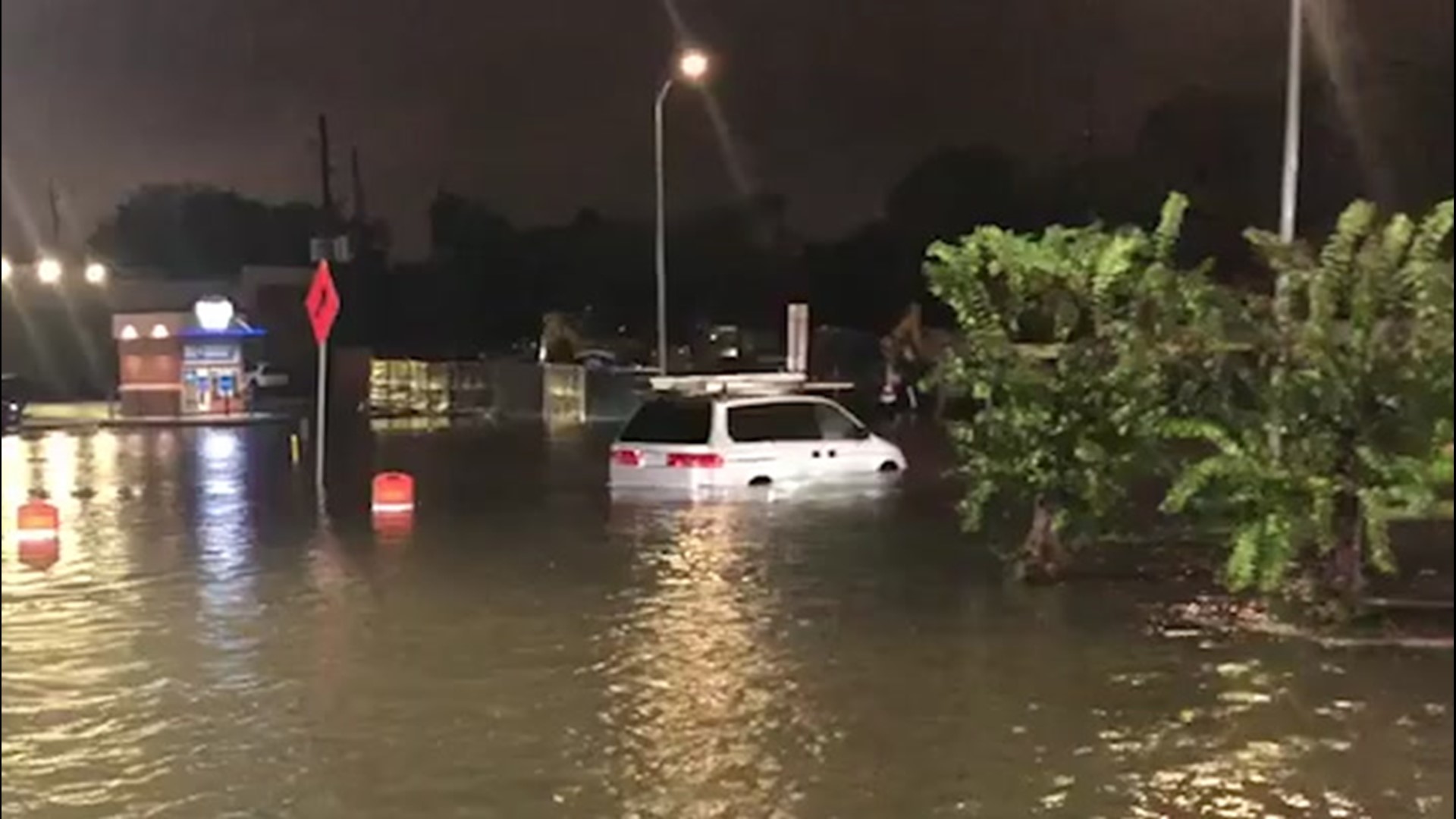 Heavy rain from Tropical Storm Beta produced flooding in Houston, Texas, in the evening of Sept. 21. Multiple vehicles in this parking lot are seen submerged.