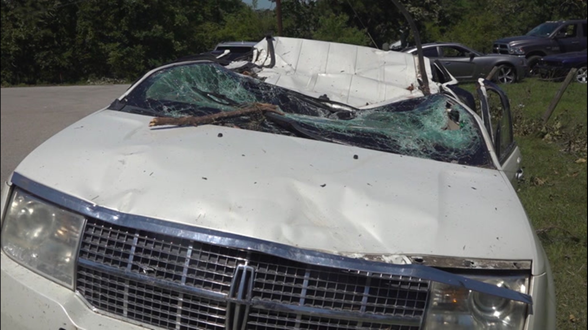 Driver survives tree crushing his SUV during twister