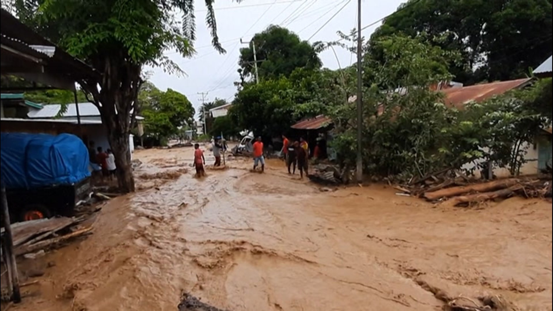 More than 100 people were killed in Indonesia and Timor-Leste when torrential rain led to devastating flooding and landslides, submerging villages in mud.