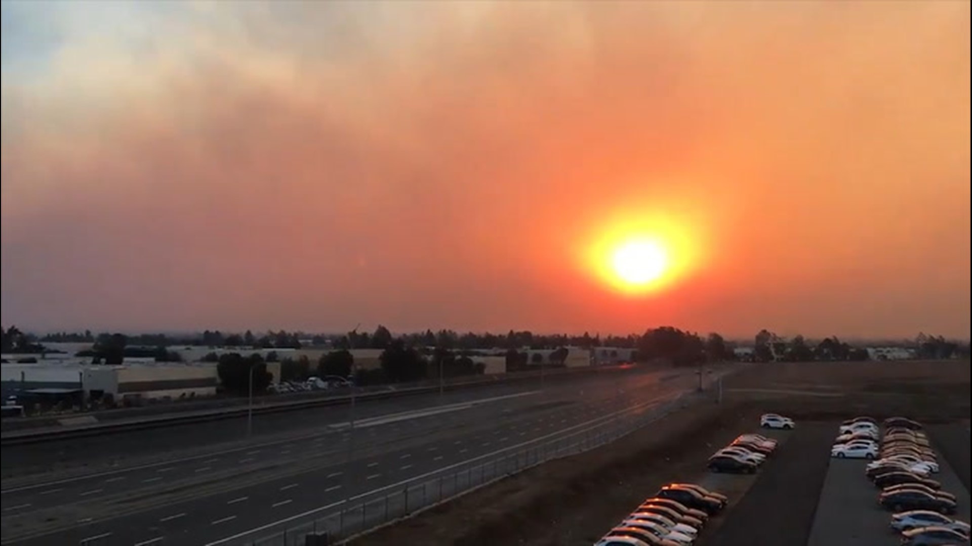 Video of a sunrise in Tustin, California, on Dec. 3, shows smoke from the Bond Fire in Orange County obscuring the sun before panning over to show the Airport Fire in Riverside County in the other direction.