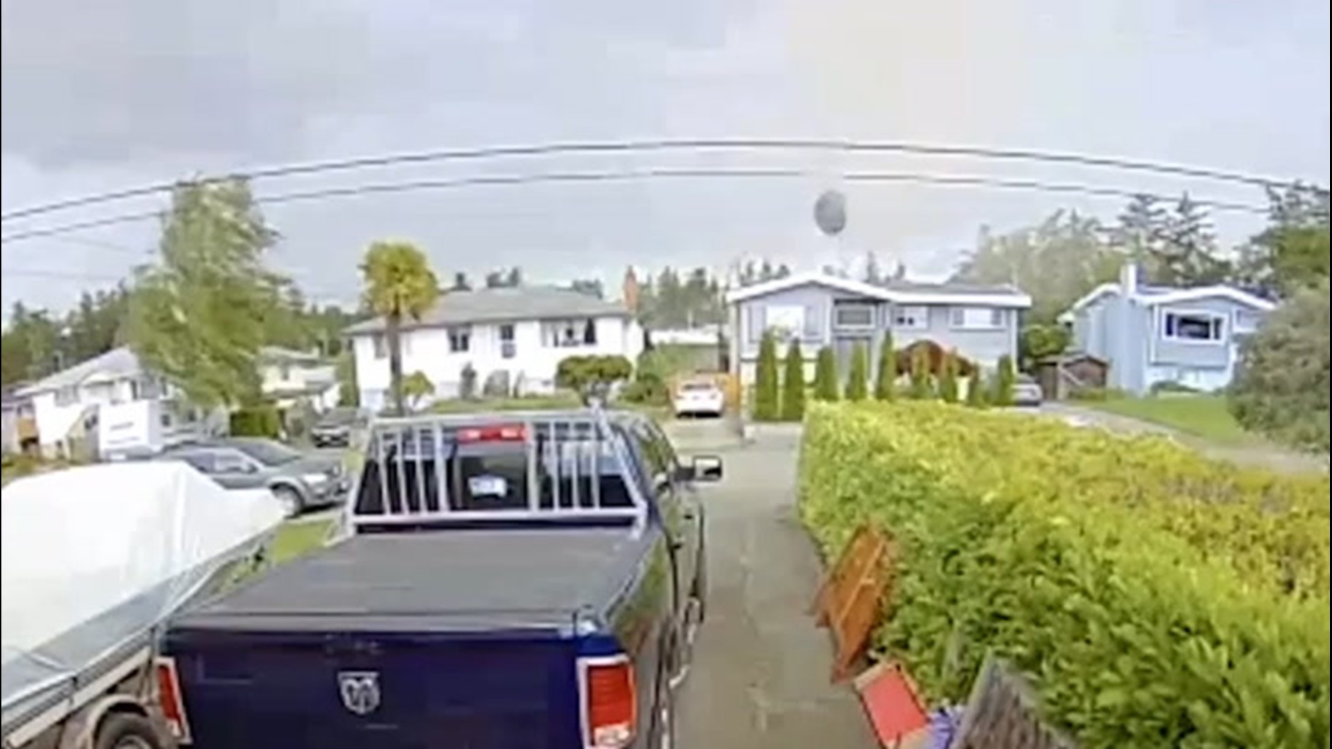 A home security camera captured the moment a possible tornado sent a trampoline flying into the air in Vancouver Island, British Columbia, on May 21.