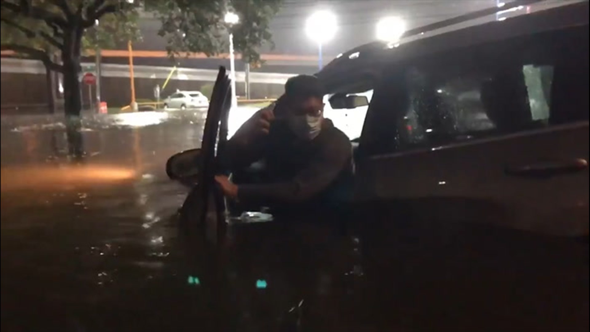 A man escaped from his SUV after it became trapped in floodwaters in Houston, Texas, on Sept. 21, as Tropical Storm Beta lashed the area, triggering flash flooding.