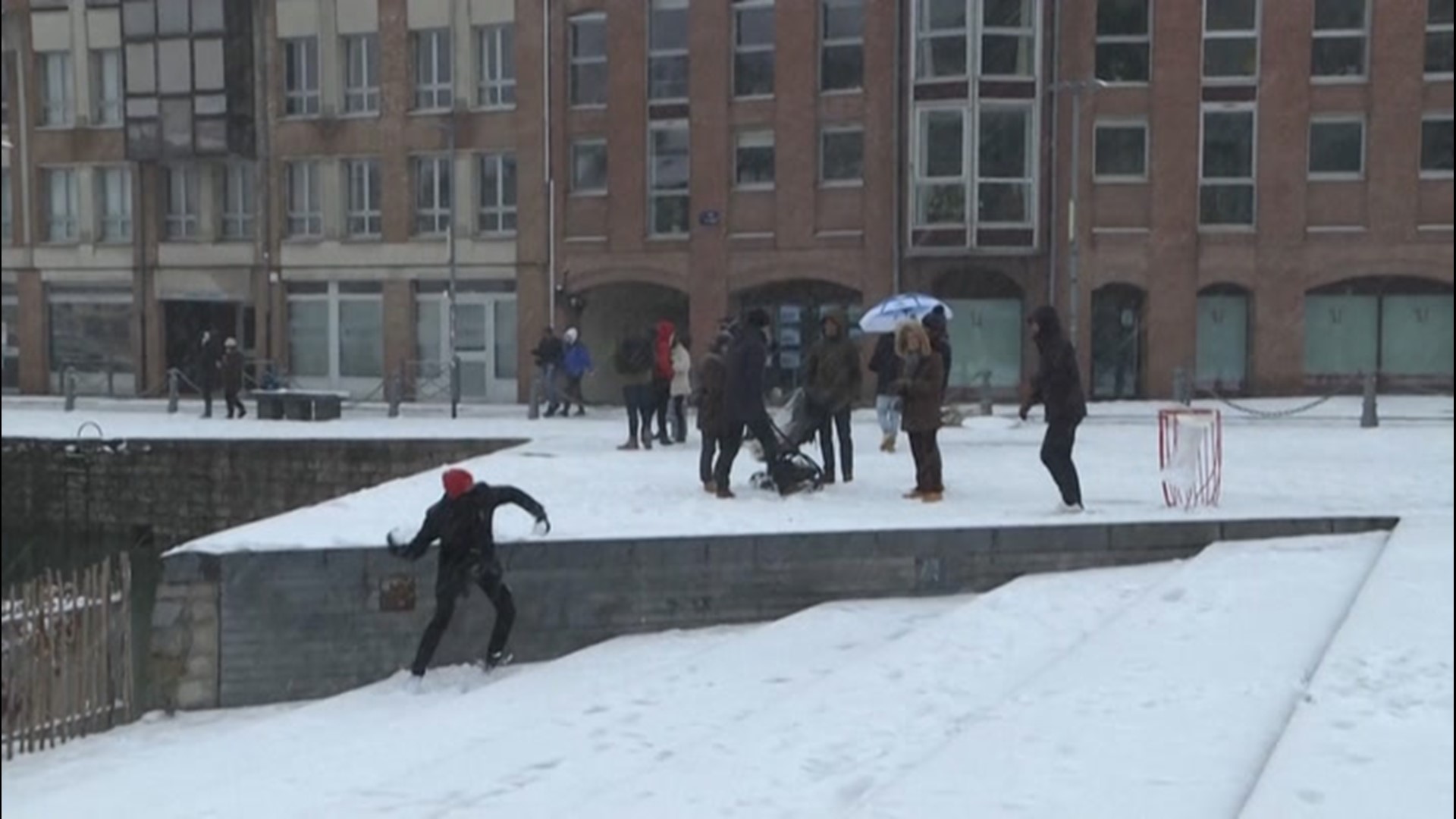 Residents in Lille, France, take advantage of the snowfall on Jan. 16.