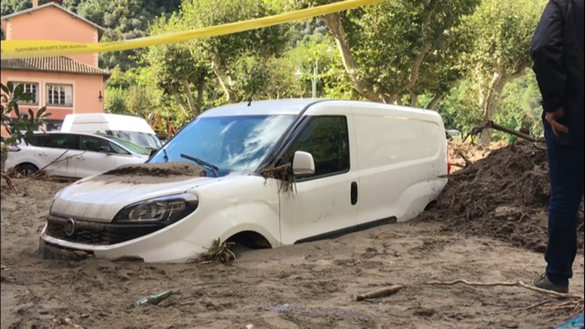 Vehicles trapped in mud after devastating floods