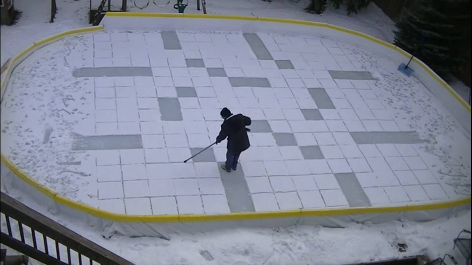 Bob Greenfield first shoveled snow into a design to tell his wife 'I love you.' Since then, he's become a sensation, with versions of the Mona Lisa, cartoon characters, and now, a giant crossword.