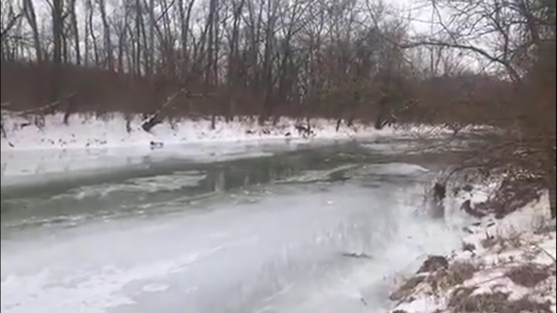 You can hear constant cracking in the ice as the Twin Creek, in Germantown MetroPark, thawed on Feb. 26.