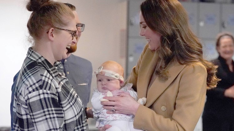 Kate Middleton Cuddles a Baby and Prince William Says, 'Don't Give My Wife Any More Ideas!'