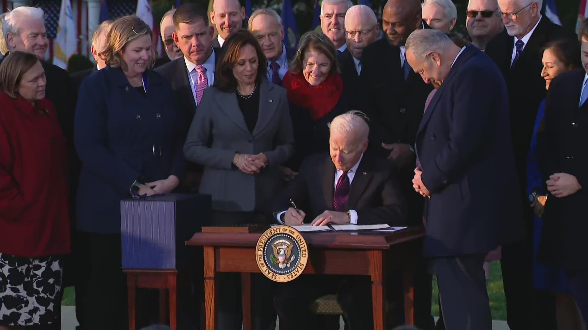 Biden signed the $1 trillion bipartisan infrastructure bill into law during a ceremony Monday afternoon on the South Lawn of the White House in Washington.