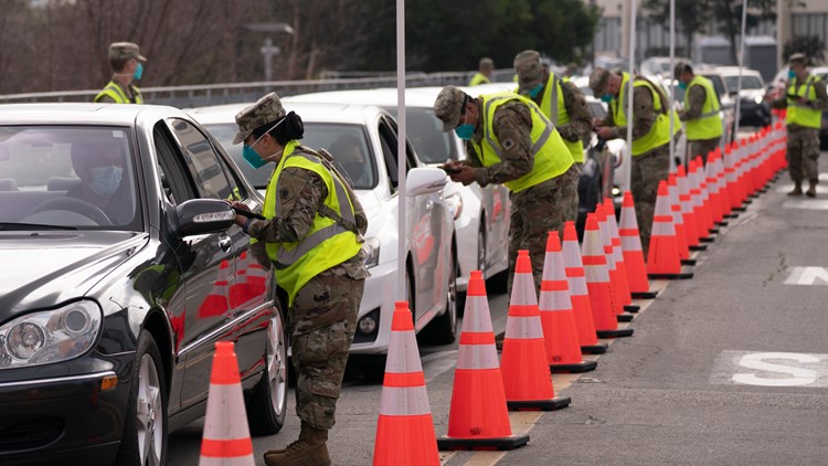 FEMA opens first mass vaccine sites as bad weather hampers efforts