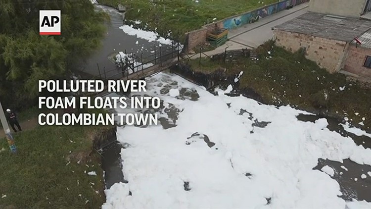 Polluted river foam floats into Colombian town