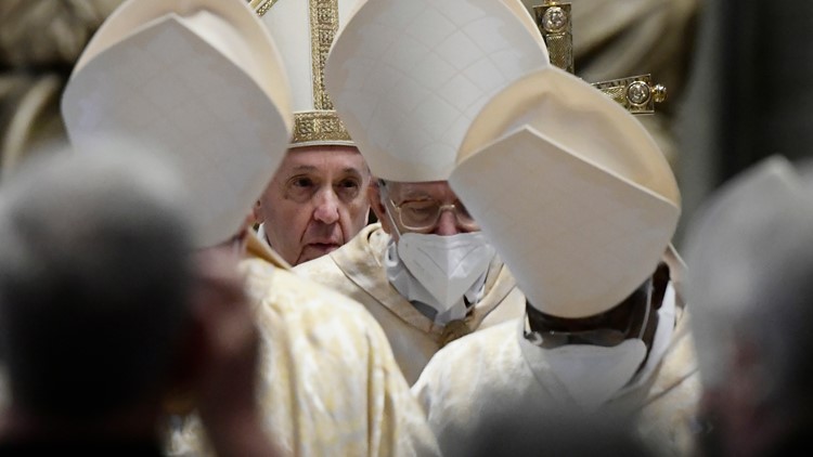 Singing hymns through masks, Christians mark pandemic Easter