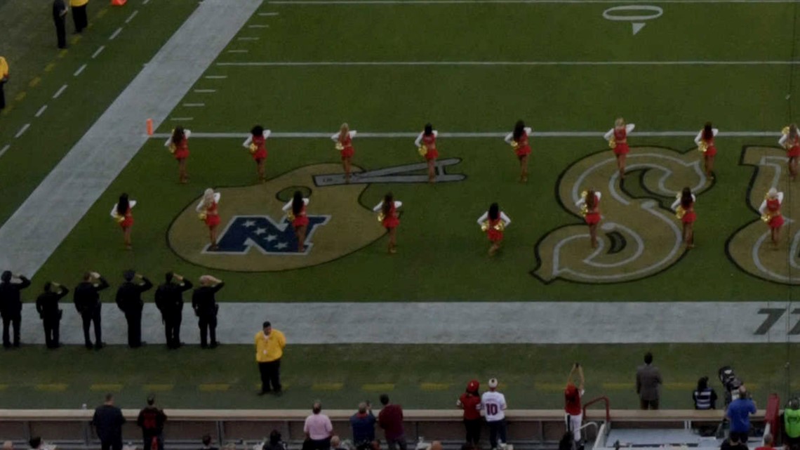 San Francisco 49ers cheerleader takes a knee during US national