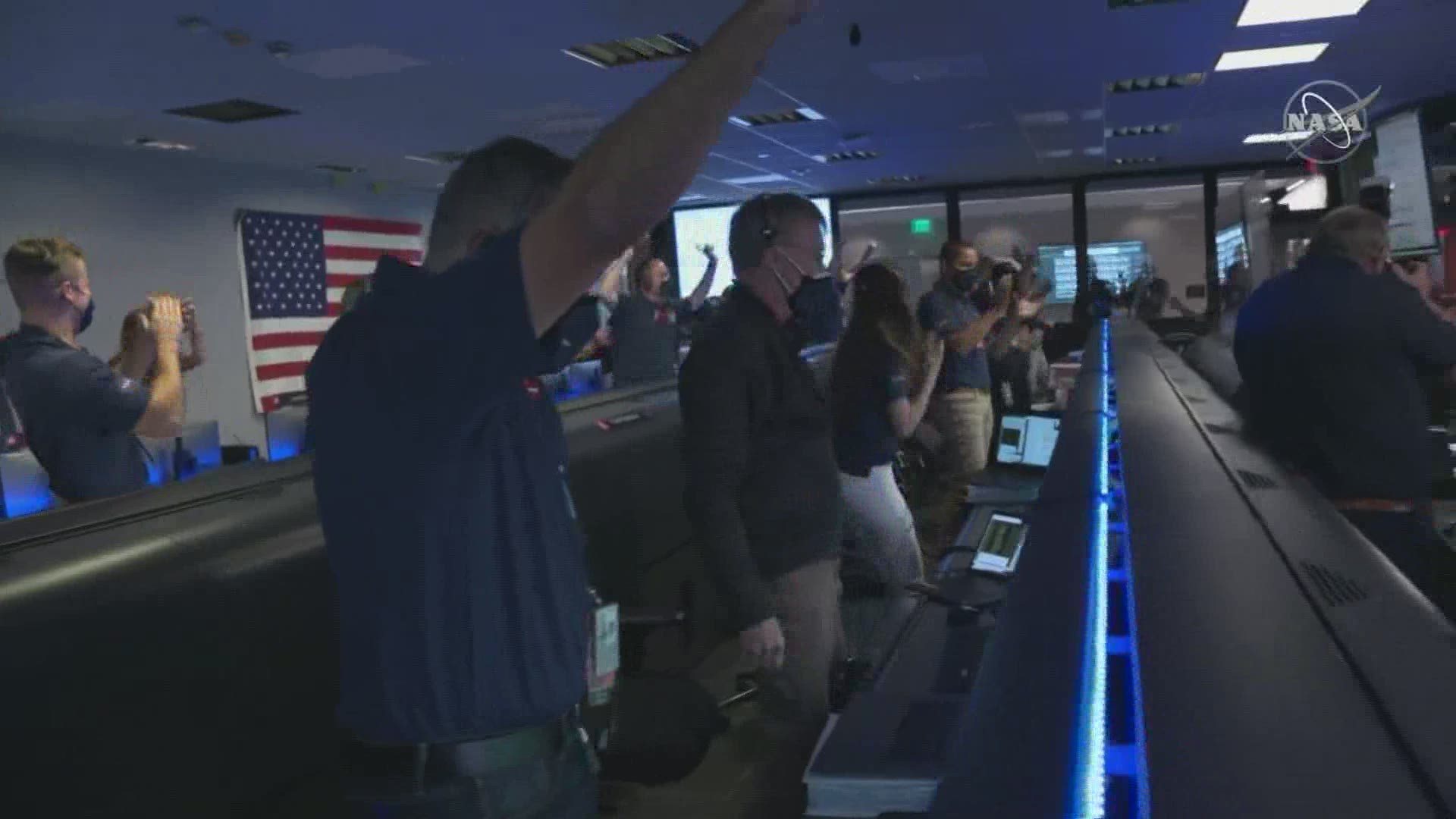NASA team cheers as the Perseverance rover lands on Mars.