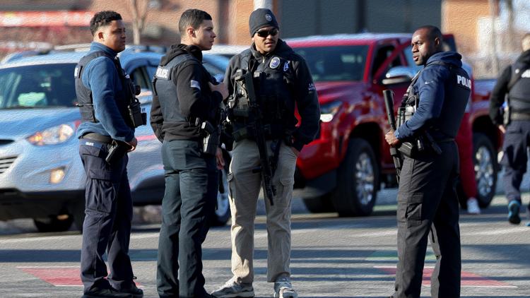 Police congregate near the Lynch Arena in Pawtucket, R.I., after a shooting at the ice rink, Monday, Feb. 16, 2026. (AP Photo/Mark Stockwell)