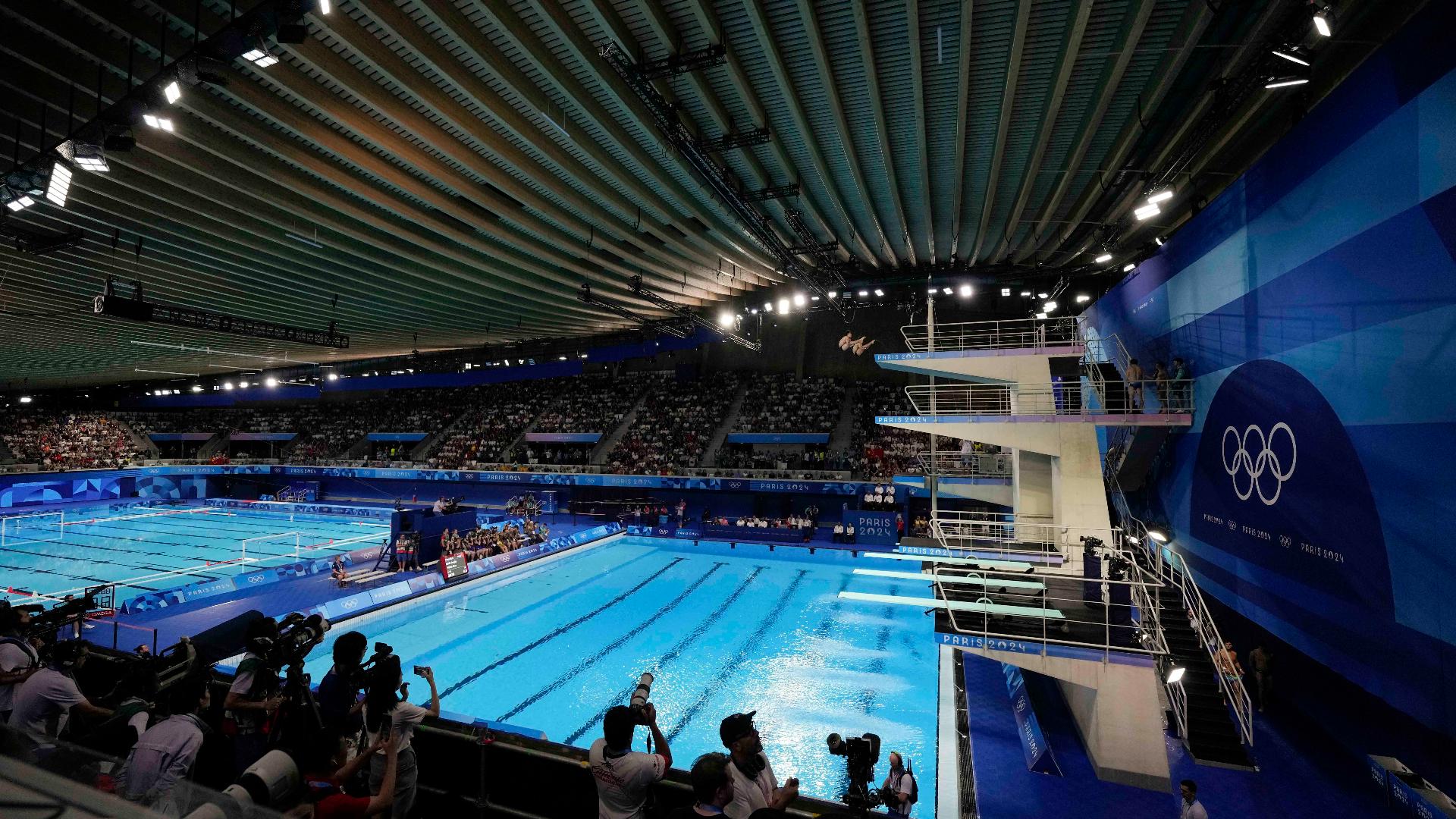 Why do Olympic divers shower after they dive?