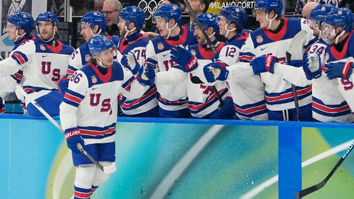 United States' Jack Hughes (86) celebrates after scoring his side's third goal during a men's ice hockey semifinal game