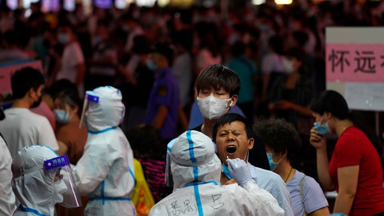 Chinese city locks down neighborhood after virus upsurge