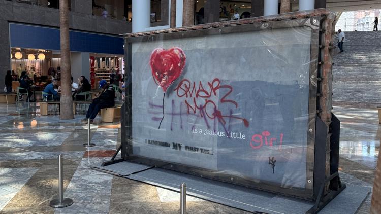 Banksy's 'Broken Heart' painting defaced on a Brooklyn wall is up for sale