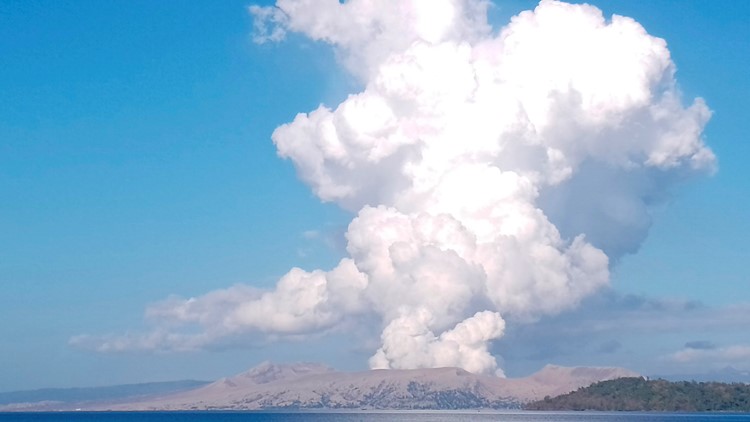 Evacuation urged as Philippine volcano spews steam, ash