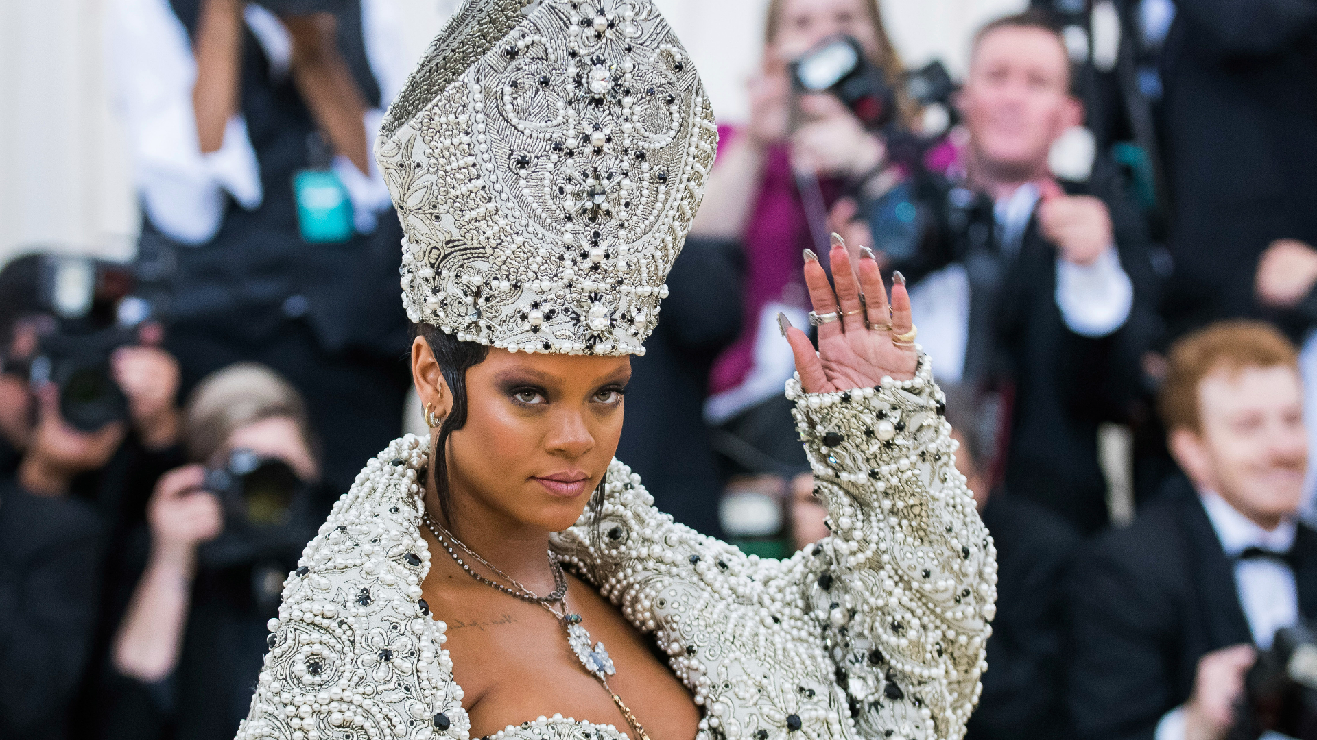 Rihanna coyly announced the news first, sharing a photo of her hand holding up a football.