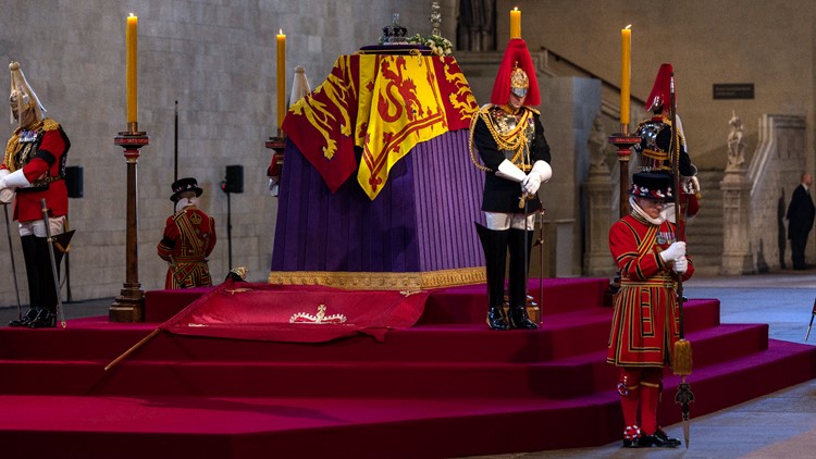 Queen Elizabeth II lies in state after solemn procession