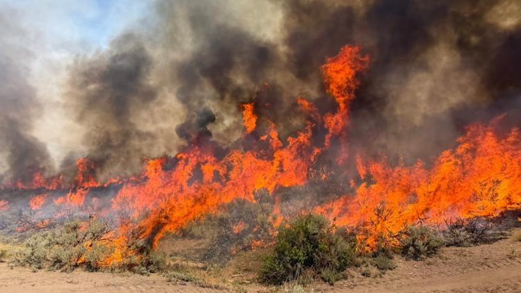 Coverage image for: Helicopter helping battle Utah wildfire crashes with 2 aboard
