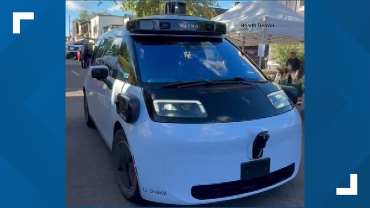 WATCH: Waymo drives into Denver farmers market, leaving workers scrambling to clear the road