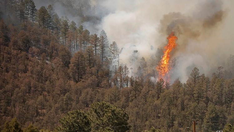 Crews fight New Mexico fire, some evacuations lift