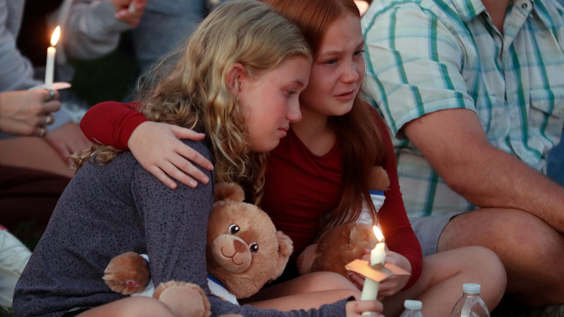 Speaking to a silent crowd crammed shoulder-to-shoulder, Archbishop Bernard Hebda described the students trying to shield their classmates as the gunfire erupted.