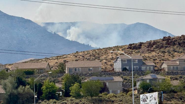 Thousands evacuate Reno, Nevada as 'human-caused' fire rips through neighborhoods