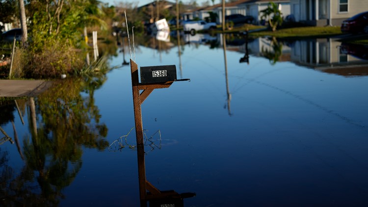 'We need help': Poor Florida neighborhood battered by flood tries to recover