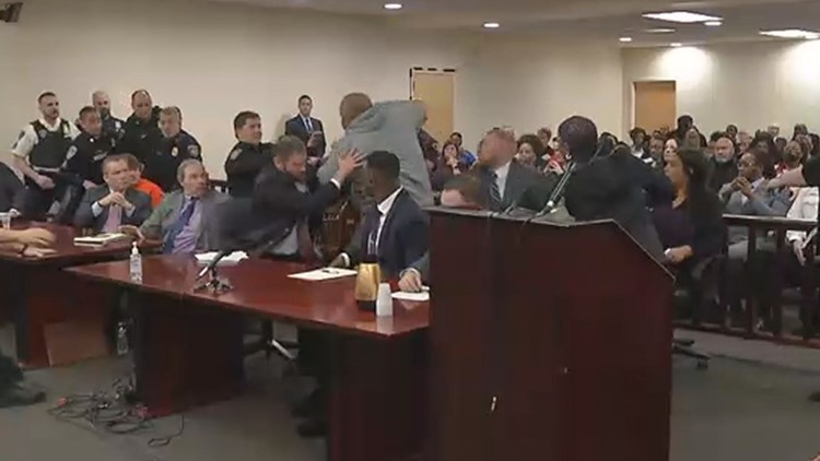 Buffalo shooter rushed from court during sentencing after man charges at him