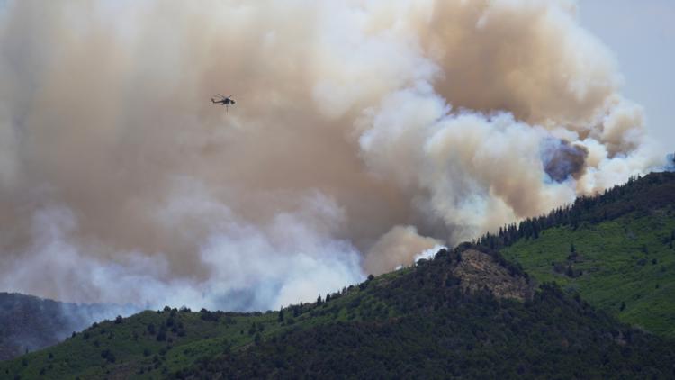 Helicopter helping battle Utah wildfire crashes with 2 aboard