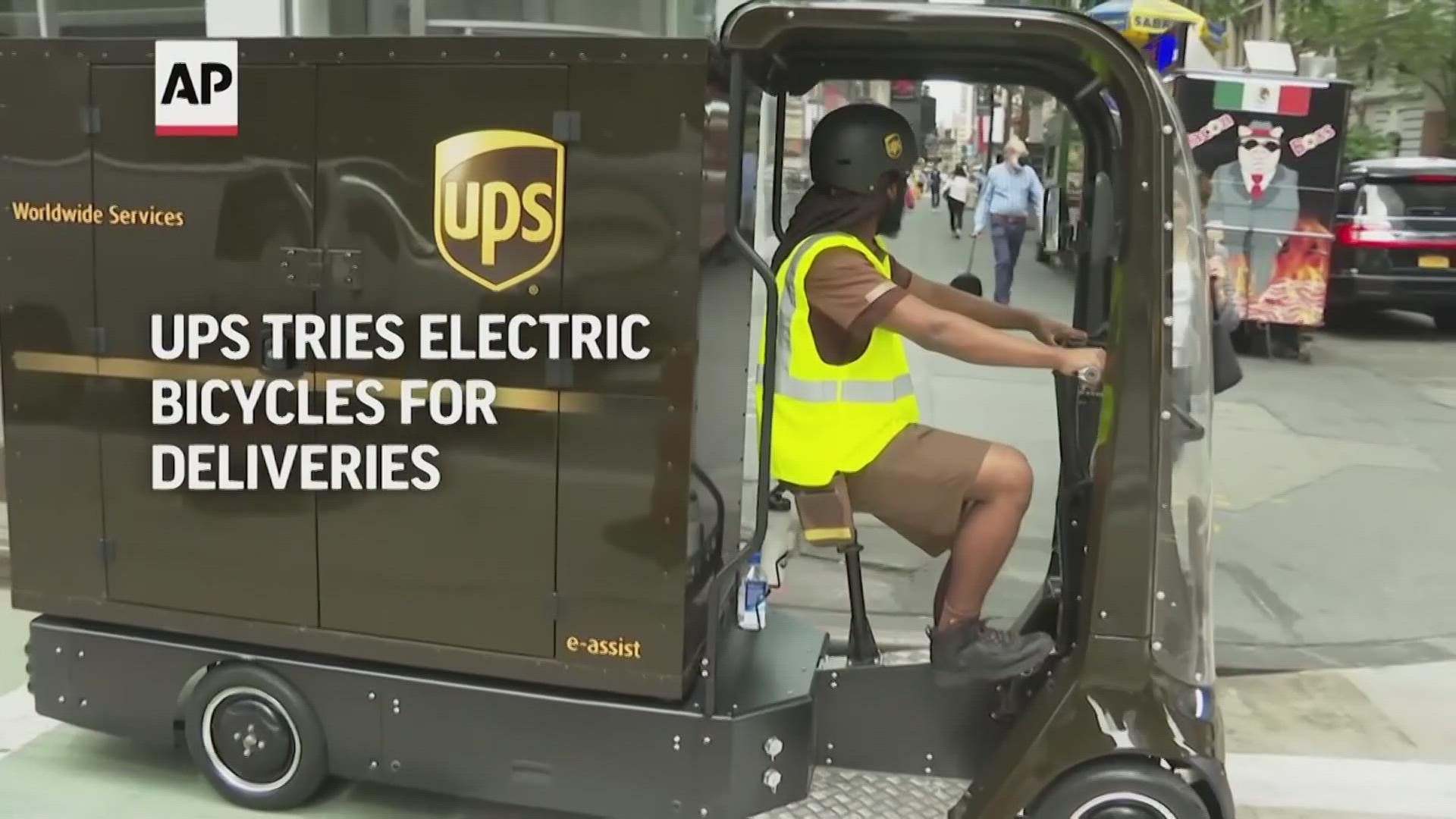 WATCH: UPS hopes these little vehicles will help carriers navigate some of the world's most congested streets.