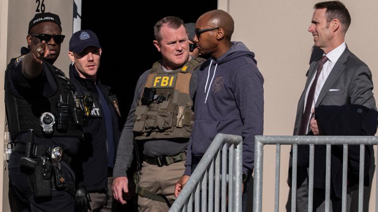 FBI agents are seen at the Fulton County Election Hub and Operation Center, Wednesday, Jan. 28, 2026, in Union City, Georgia, near Atlanta.