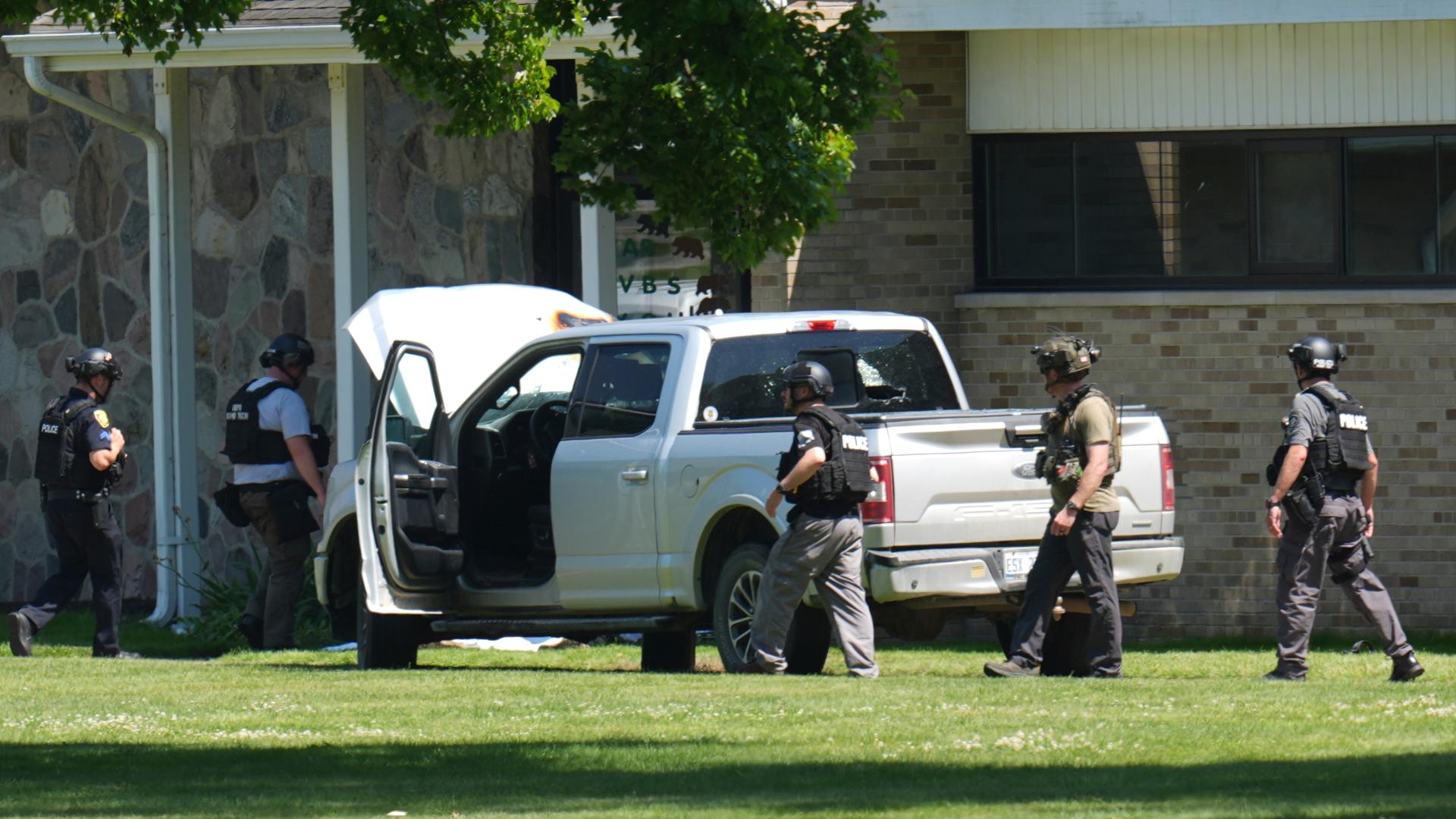 A man who opened fire outside a Michigan church filled with worshippers on Sunday was struck by a vehicle and then fatally shot by security staff.