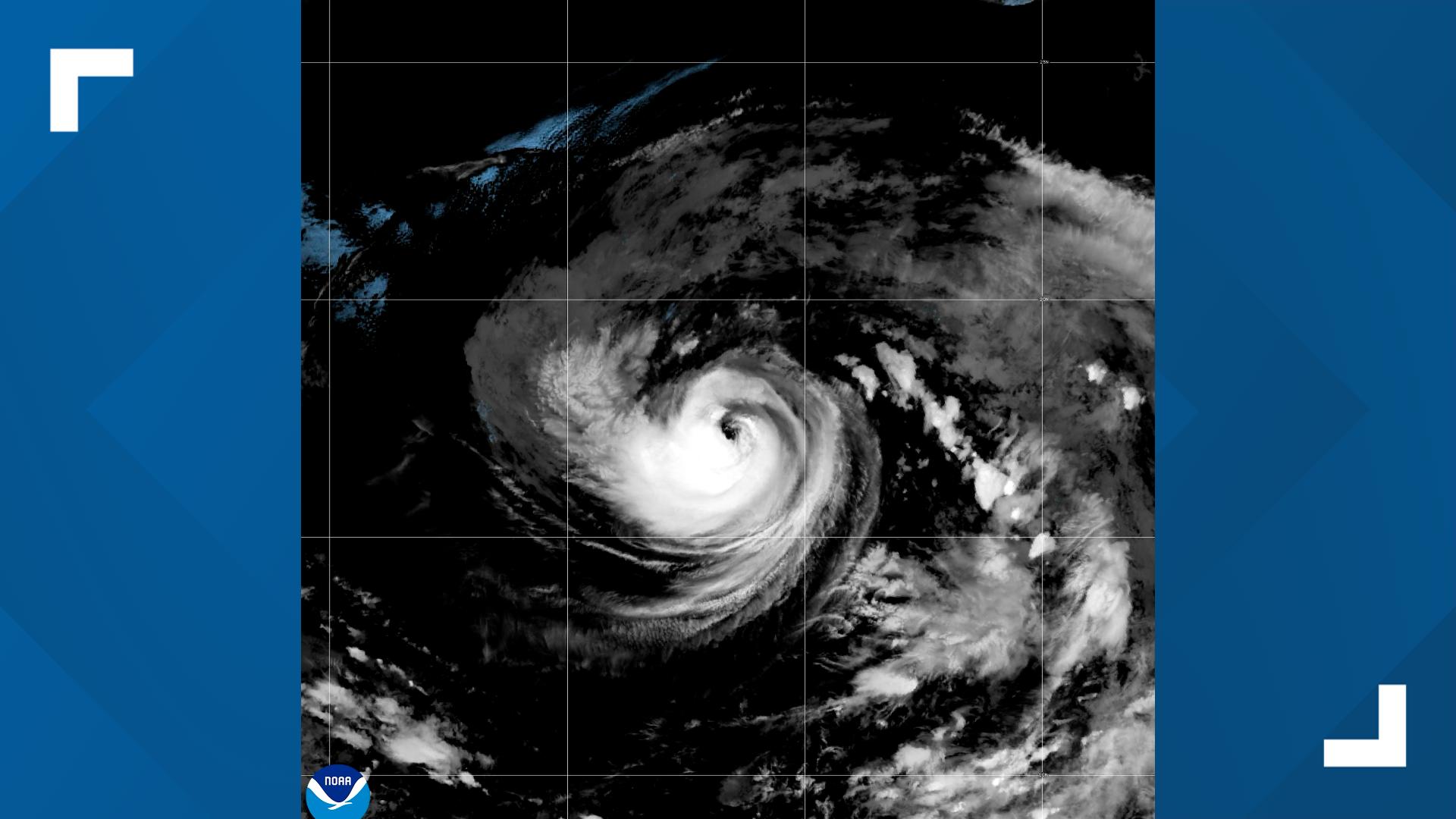 Tropical Storm Karina strengthens into a Category 1 hurricane in the Pacific; storm's center far out at sea, not threatening land