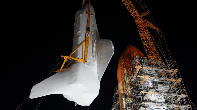 Space Shuttle Endeavour hoisted for installation in vertical display at Los Angeles science museum